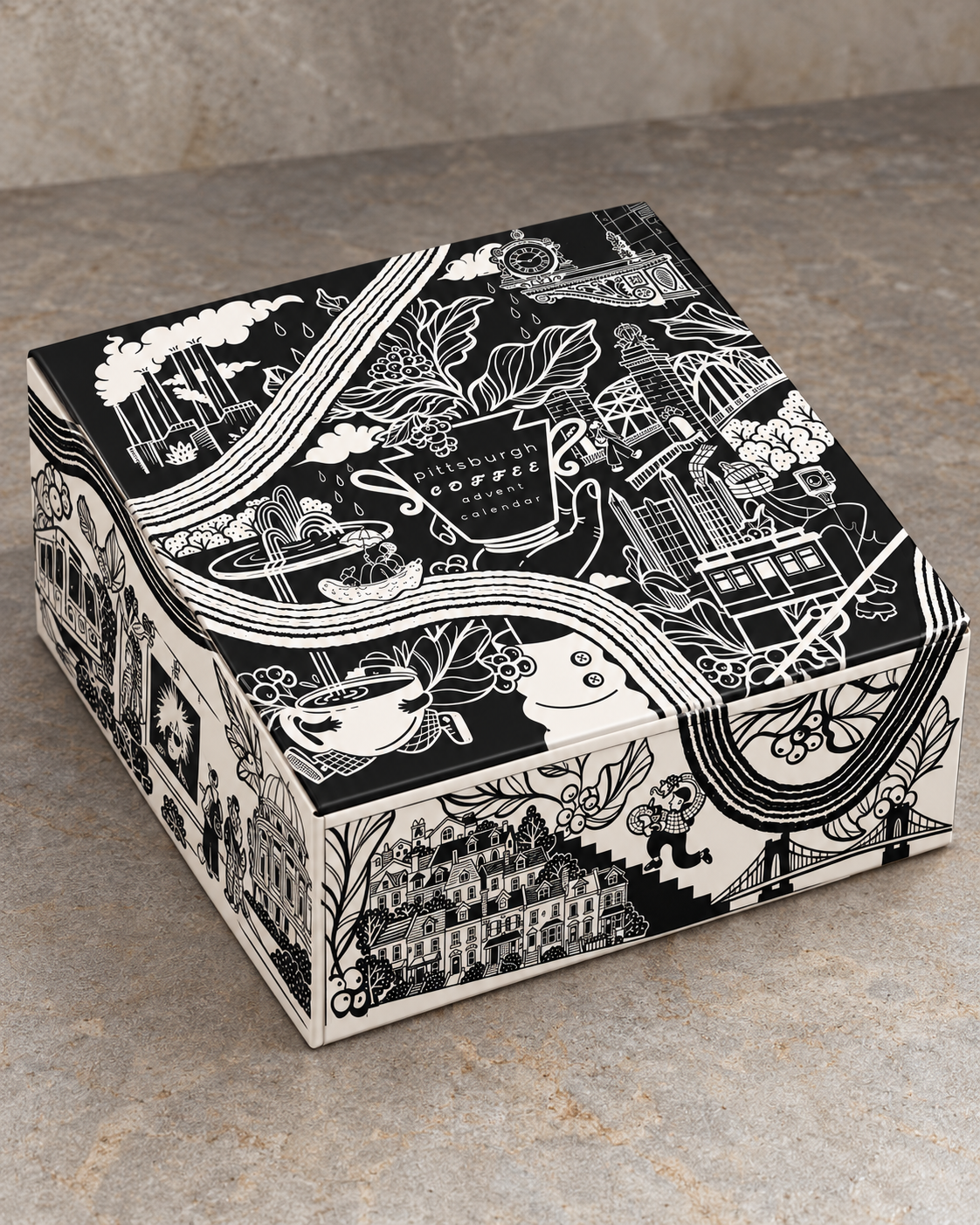 Rendering of the Pittsburgh Coffee Advent Calendar box with Eleni Demeter’s black-and-white illustrations of Pittsburgh landmarks and coffee.